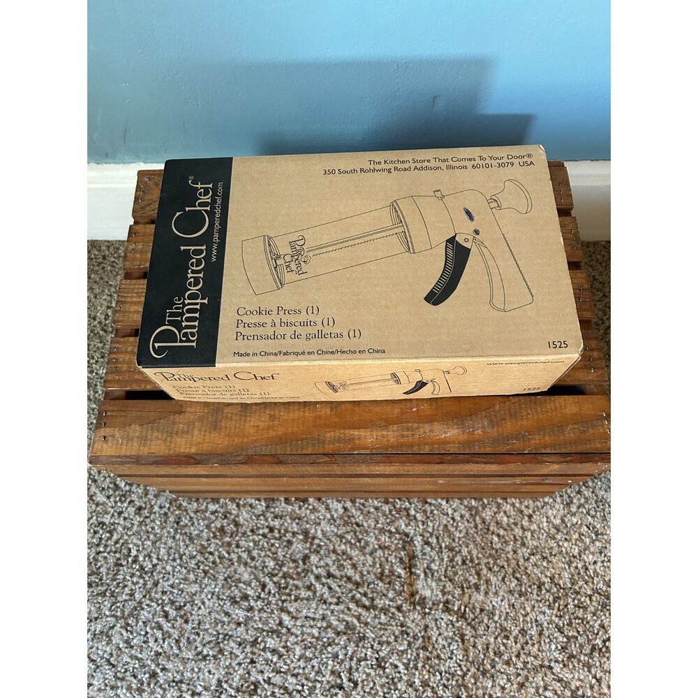 The Pampered Chef cookie press with 16 disks and instructions